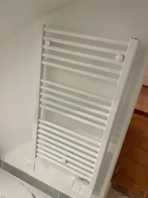 a white refrigerator freezer sitting in a room at plaisir de vacances in Aix-en-Provence
