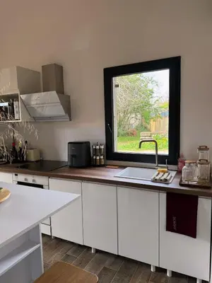a kitchen with a sink and a window at COZY LOFT - Maisonnette esprit loft in Saint-Cannat