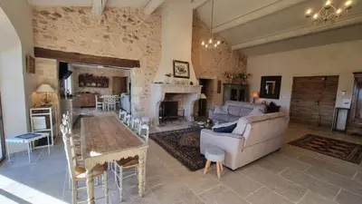 a living room with a couch and a table at La Fabrique in Gargas