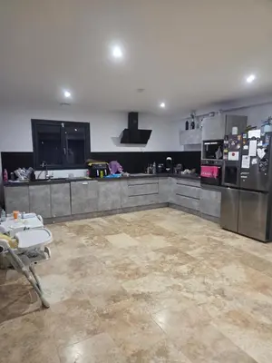 a large kitchen with stainless steel appliances at Villa situé à Sainte-Tulle in Sainte-Tulle