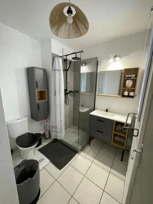 a kitchen with a table and a counter top at Appartement en résidence privé Avignon Agroparc in Avignon