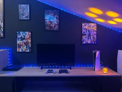 a room with a tv on a table with blue lights at Villa moderne tout confort in Salon-de-Provence