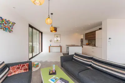 a living room with a couch and a table at Elynéa - Vue panoramique - Haut standing - Piscine in Rognes