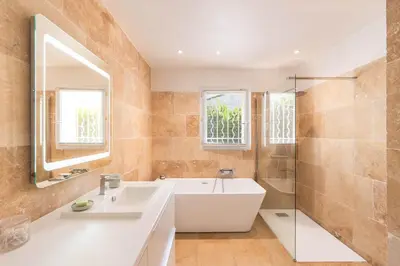 a bathroom with a tub and a sink and a shower at Mas Noves - Horizon Alpilles villa in Noves