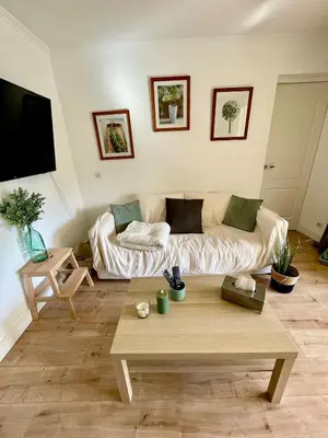 a living room with a couch and a coffee table at Appartement Domaine du Golf de Pont Royal in Mallemort