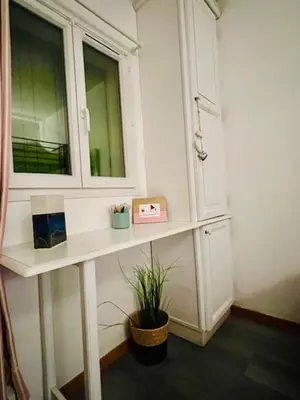a room with a table with a mirror and a plant at Appartement Domaine du Golf de Pont Royal in Mallemort