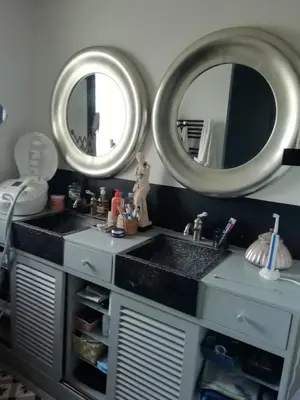 a bathroom with two sinks and two mirrors at Maison individuelle in Morières-lès-Avignon