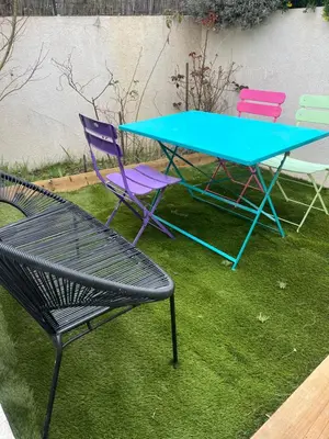 a table and two chairs and a table and chairs at Appart Ethan PROCHE DU CENTRE AVEC PARKING ET JARDIN in Aix-en-Provence