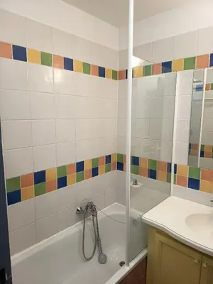 a bathroom with a shower and a tub and a sink at Golf de pont royal in Mallemort