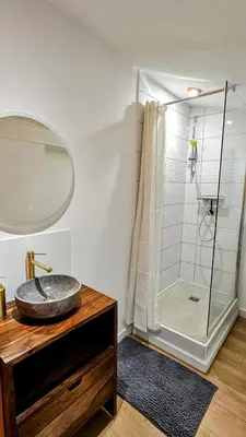 a bathroom with a sink and a shower at Duplex Aix Sunset Coeur centre historique in Aix-en-Provence