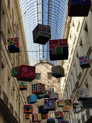 a bunch of colorful umbrellas hanging from a ceiling at Studio Vacances super équipé in Carpentras
