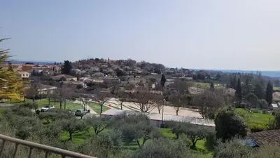a view of a town with houses and trees at Maison de charme in Pierrevert