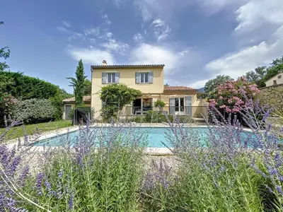 a house with a swimming pool in a garden at Maison LEA in Bédoin