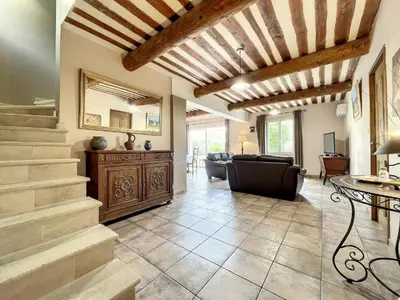 a living room with a staircase and a couch at Maison LEA in Bédoin
