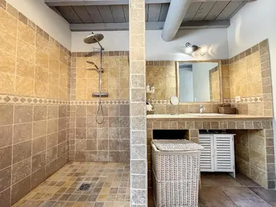 a bathroom with a shower and a sink at Maison LEA in Bédoin