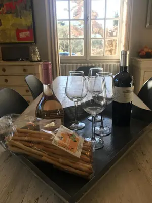 a living room with a table and chairs and a couch at Les Esperelles in Lagnes