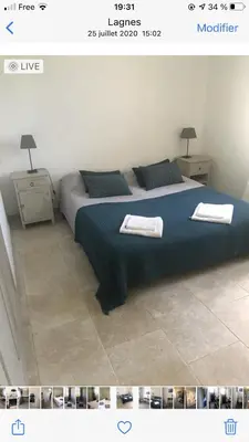 a bedroom with a bed with two towels on it at Les Esperelles in Lagnes