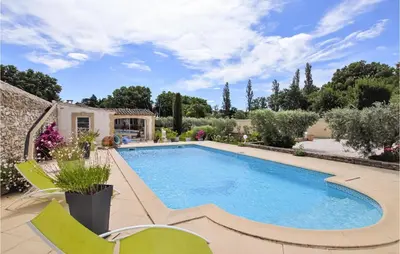 a swimming pool in a yard with a house at Beautiful Home In Lancon De Provence in Lançon-Provence