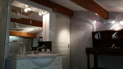 a bathroom with a sink and a mirror at Duplex En Provence in Vedène