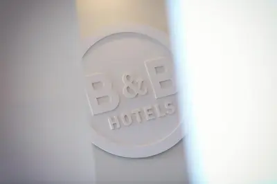 a close up of a bottle of baxter hotels logo at B&B HOTEL Salon de Provence in Salon-de-Provence