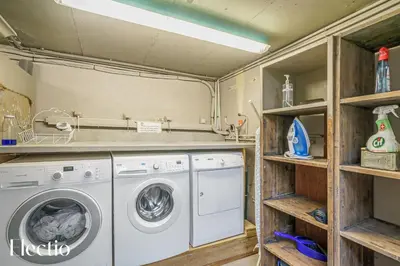 a laundry room with a washer and dryer at Résidence Les Petitons in Oppède