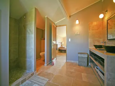 a bathroom with a shower and a sink and a toilet at Villa in Lubéron with Saltwater Pool in Apt