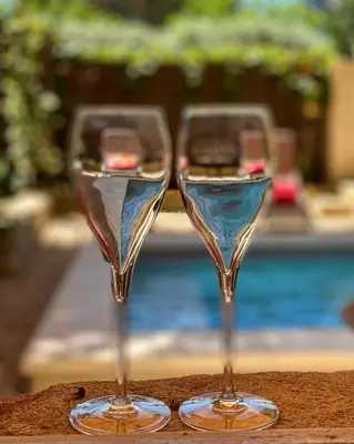 two wine glasses sitting on top of a table at L'Escarpolette in Saint-Saturnin-les-Apt