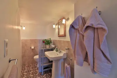 a bathroom with a sink and a toilet at Le Jardin de Mazan in Mazan