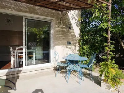 a blue table and chairs on a patio at Mas Nina Rosa in Mazan