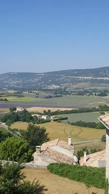 a view of the countryside from the top of a building at Hotel Belvue in Sault-de-Vaucluse