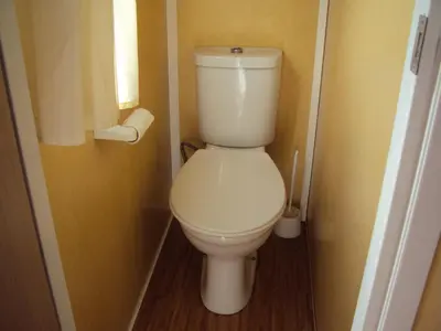 a bathroom with a toilet in a small room at B&B La Douloire in Pernes-les-Fontaines