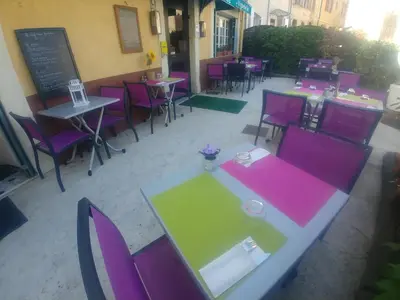 an overhead view of a restaurant with tables and chairs at L'Aiguebelle in Céreste