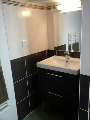 a bathroom with a sink and a mirror at Colombe in LʼIsle-sur-la-Sorgue