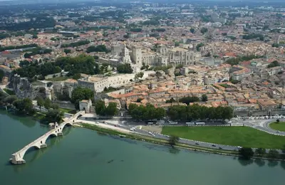 an aerial view of a city with a bridge over a river at Gîte en Provence in Entraigues-sur-la-Sorgue