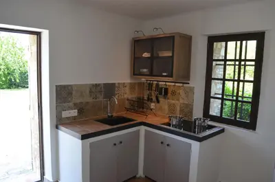 a kitchen with a sink and a counter top at Campagne Chastel in Aix-en-Provence