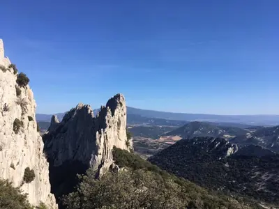 a view of the mountains from the top of a mountain at La roulotte Chic et Boheme in Mazan