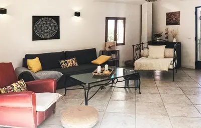 a living room with a couch and a table at 2 Bedroom Stunning Home In Apt in Apt
