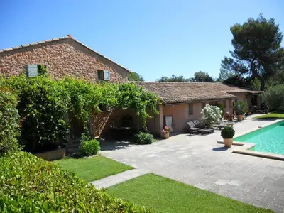 a house with a swimming pool and a yard at B&B La Badelle in Gordes