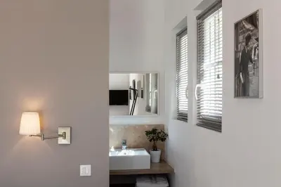 a bathroom with a sink and a mirror at Chambre d'hôtes le Mirail in La Motte-dʼAigues