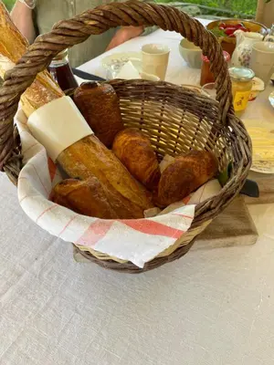 a basket filled with bread on top of a table at Domaine Saint Jean in Saint-Saturnin-les-Apt