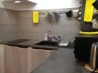 a kitchen with a sink and a counter at Appartement le Platane in Pertuis