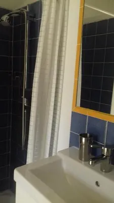 a bathroom with a sink and a mirror and a shower at Les grands pins in Saint-Andiol