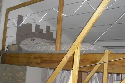 a bunk bed with lights on top of it at Lou mas li Pitchoun 