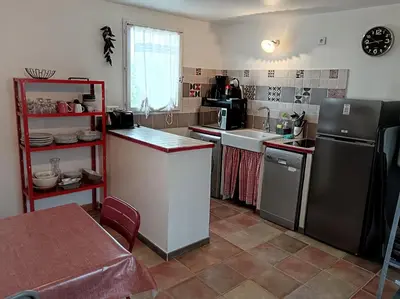 a small kitchen with a sink and a refrigerator at Le Petit Mas des Hauts de Beyssan, Maison de vacances avec piscine privative pour 2 personnes in Gargas