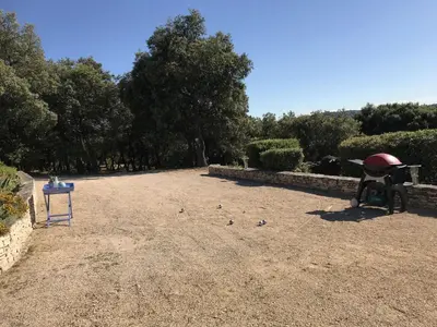 a large yard with a table and birds on the ground at Sunny Provence Getaway in Villes-sur-Auzon