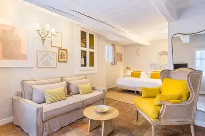 a living room with a couch and a bed at Château de Mazan - Handwritten Collection in Mazan