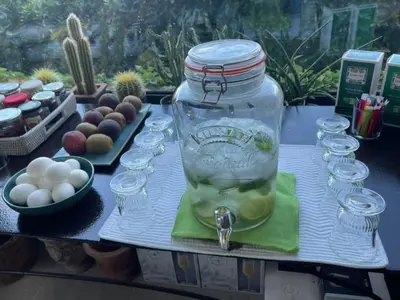 a mason jar filled with water on a table at La Borie en Provence in Gordes