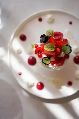 a plate of food with fruit and berries on it at Hôtel Restaurant Mas de Fauchon - Teritoria in Saint-Cannat