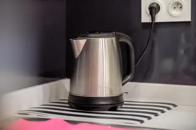 a coffee pot sitting on top of a stove at Appart Hypercentre CLIM 2chb QuartierChic in Aix-en-Provence