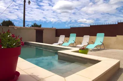 a swimming pool with lounge chairs and a swimming pool at Que Passion in Blauvac